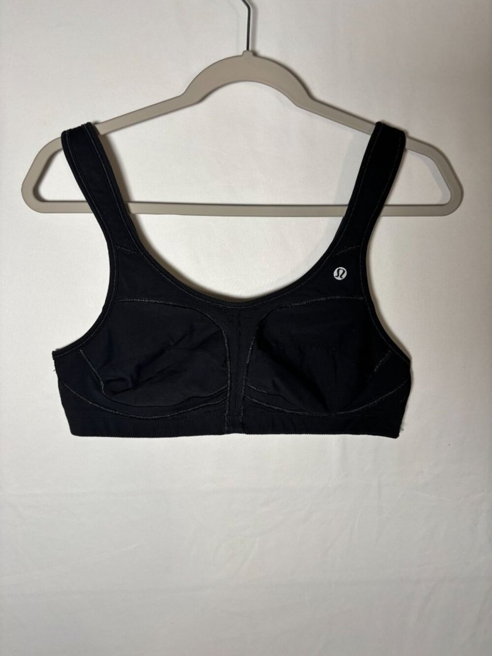 Lululemon black sports bra (size tag missing, estimated S/M based on fit)